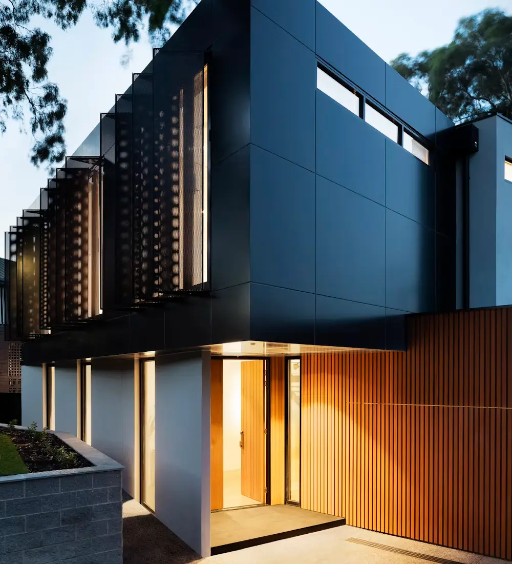 Contemporary luxury home at dusk, representing real estate and property developer marketing