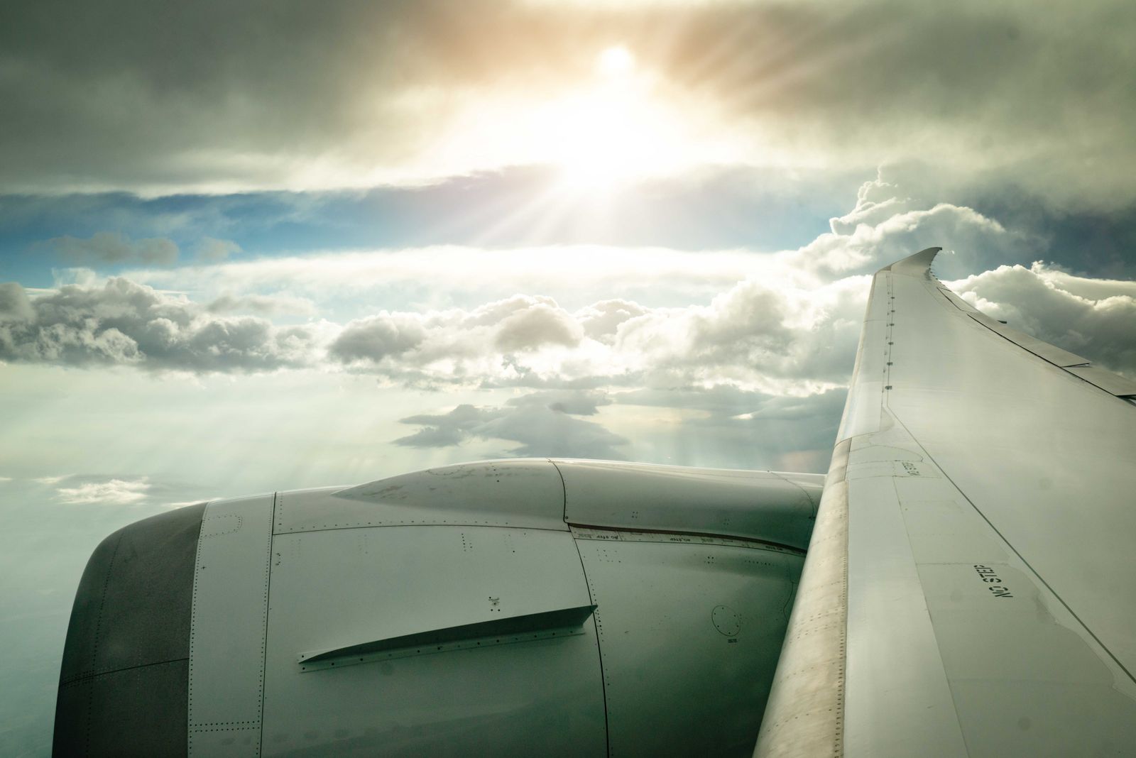 Aircraft wing above the clouds on an international flight