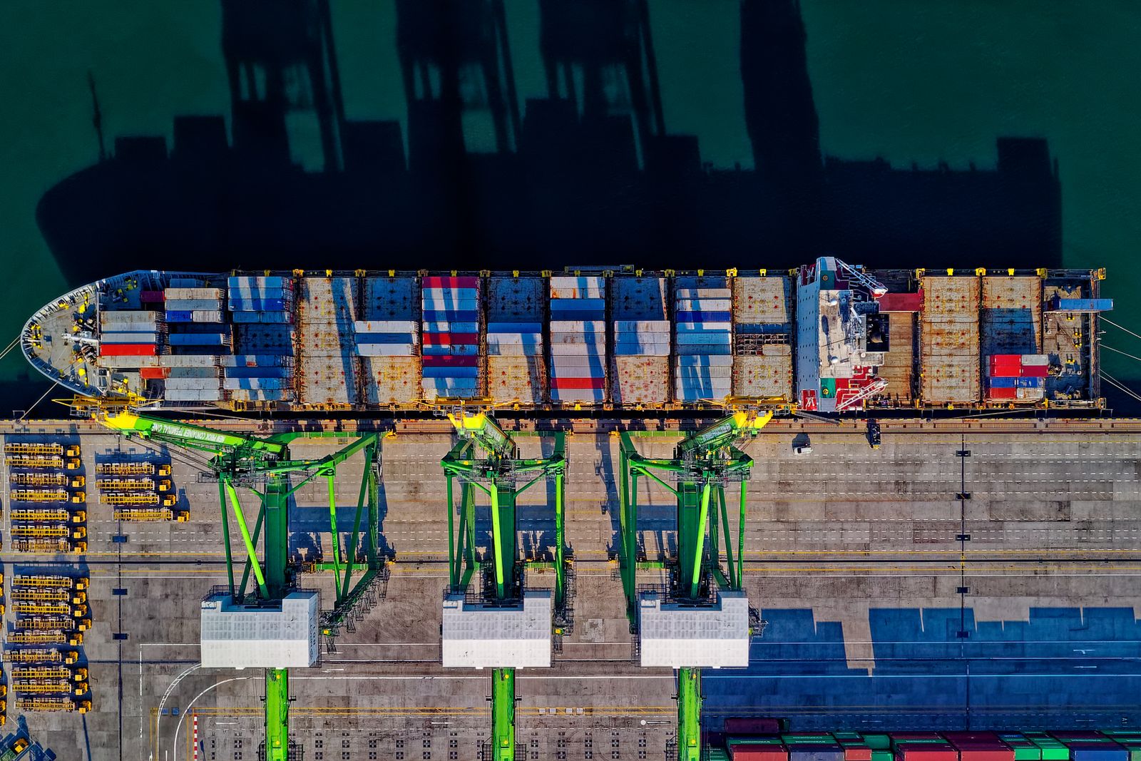 Aerial view of a container ship being loaded at an international port